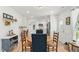 Charming dining room with a round table and view into the bright kitchen at 221 Moon Cir, Dunn, NC 28334