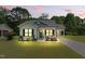 Charming home featuring a manicured lawn, cozy porch, and convenient carport at 221 Moon Cir, Dunn, NC 28334