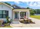 Inviting front porch with seating and charming landscaping at 221 Moon Cir, Dunn, NC 28334