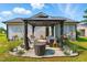 Cozy outdoor gazebo with comfortable seating, perfect for entertaining or relaxation in the backyard at 221 Moon Cir, Dunn, NC 28334