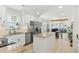 Open-concept kitchen with granite countertops and stainless steel appliances flows into the living area at 221 Moon Cir, Dunn, NC 28334