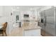 Bright kitchen features granite countertops, stainless steel appliances, and white cabinetry at 221 Moon Cir, Dunn, NC 28334