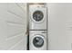 Convenient laundry room with stacked washer and dryer at 221 Moon Cir, Dunn, NC 28334