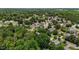 Expansive aerial view capturing lush greenery, serene neighborhood streets, and a canopy of mature trees at 2216 Hoskins Rd, Burlington, NC 27215