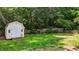 Spacious backyard featuring a shed, lawn area, and wood fence at 2216 Hoskins Rd, Burlington, NC 27215