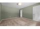 Bedroom features green walls, carpet, ceiling light, and access to other rooms at 2216 Hoskins Rd, Burlington, NC 27215