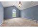 Large bedroom with vaulted ceilings, neutral paint, and lots of natural light at 2216 Hoskins Rd, Burlington, NC 27215