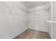 Walk-in closet with white wire shelving on all sides and neutral carpet at 2216 Hoskins Rd, Burlington, NC 27215
