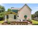 Charming home exterior featuring awning-covered windows and a well-maintained brick patio at 2216 Hoskins Rd, Burlington, NC 27215