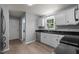 Efficient kitchen featuring stainless steel appliances, granite countertops, and bright white cabinetry at 2216 Hoskins Rd, Burlington, NC 27215