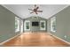 Spacious living room with high ceilings, a ceiling fan, and multiple windows for ample natural light at 2216 Hoskins Rd, Burlington, NC 27215