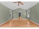 Expansive living area boasts a vaulted ceiling, recessed lighting, hardwood floors, and ample natural light at 2216 Hoskins Rd, Burlington, NC 27215