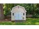 Backyard shed with double doors, adjacent to a grassy area at 2216 Hoskins Rd, Burlington, NC 27215