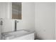 Bathroom featuring a new vanity and faucet, awaiting a mirror to be placed at 2396 Spring Valley Rd, Henderson, NC 27537