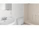 Cozy bathroom featuring a pedestal sink, toilet, and a tub at 2396 Spring Valley Rd, Henderson, NC 27537