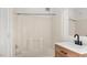 Clean bathroom with tub and shower combo and modern vanity at 2396 Spring Valley Rd, Henderson, NC 27537