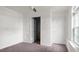 Bright bedroom boasts neutral walls, carpet, and a double door closet at 2396 Spring Valley Rd, Henderson, NC 27537