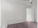 A cozy bedroom featuring neutral walls, plush carpet, and an open doorway at 2396 Spring Valley Rd, Henderson, NC 27537
