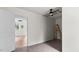 Cozy bedroom featuring neutral walls, carpet, and open door to another room at 2396 Spring Valley Rd, Henderson, NC 27537