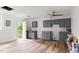 Spacious kitchen featuring new cabinets and hardwood floors at 2396 Spring Valley Rd, Henderson, NC 27537