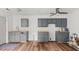 Spacious kitchen featuring new cabinets and hardwood floors at 2396 Spring Valley Rd, Henderson, NC 27537