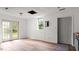 Living room featuring hardwood floors and a set of french doors at 2396 Spring Valley Rd, Henderson, NC 27537