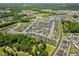 An aerial view of a neighborhood with well-maintained homes and lush greenery at 245 Tumbling River Dr, Wendell, NC 27591