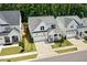 Breathtaking aerial view of a modern home with a well-maintained lawn and attractive landscaping at 245 Tumbling River Dr, Wendell, NC 27591
