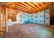 Unfinished attic space showing exposed beams, plywood, and wiring, offering potential for customization at 245 Tumbling River Dr, Wendell, NC 27591