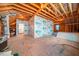 Unfinished attic space showing exposed beams, plywood, and wiring, offering potential for customization at 245 Tumbling River Dr, Wendell, NC 27591