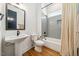 Stylish bathroom with a pedestal sink, modern fixtures, and subway tile in the shower area at 245 Tumbling River Dr, Wendell, NC 27591