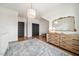 Bright bedroom featuring hardwood floors, a changing table, soft rug, and natural light from a window at 245 Tumbling River Dr, Wendell, NC 27591