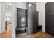 Stylish entryway with convenient built-in storage, bench seating, and hardwood floors at 245 Tumbling River Dr, Wendell, NC 27591