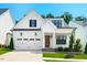 Beautiful two-story home with a well-maintained front yard and a two-car garage at 245 Tumbling River Dr, Wendell, NC 27591