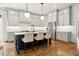 Spacious kitchen with white cabinetry, stainless steel appliances, and island seating at 245 Tumbling River Dr, Wendell, NC 27591