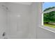 Clean bathroom features a window above the shower and a simple design at 248 Robin Loop, Dunn, NC 28334