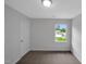 Neutral bedroom offering natural light from the window and ample space for furniture at 248 Robin Loop, Dunn, NC 28334