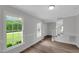 Entryway with lots of light and wood floors, with stairs leading to upper level at 248 Robin Loop, Dunn, NC 28334