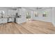 Bright kitchen featuring white cabinets, granite countertops, and stainless steel appliances at 2513 Rochelle St, Durham, NC 27703