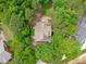 Aerial view of home surrounded by lush, mature trees and well-maintained landscaping at 297 Curragh Cv, Fuquay Varina, NC 27526
