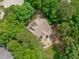 Overhead view of house surrounded by dense green trees and well-manicured yard at 297 Curragh Cv, Fuquay Varina, NC 27526