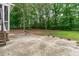 Backyard features a concrete patio perfect for entertaining and overlooks a private, wooded area at 297 Curragh Cv, Fuquay Varina, NC 27526