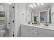 Bright bathroom with double sinks, marble countertops, and neutral paint at 297 Curragh Cv, Fuquay Varina, NC 27526
