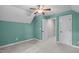 Carpeted bedroom features neutral walls, a vaulted ceiling, and an open doorway at 297 Curragh Cv, Fuquay Varina, NC 27526