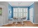 Cozy dining area with a bench seat, table, and bright natural light at 297 Curragh Cv, Fuquay Varina, NC 27526