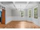Bright dining room features hardwood floors, crown molding, and a modern chandelier, perfect for entertaining guests at 297 Curragh Cv, Fuquay Varina, NC 27526