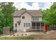 Home exterior features a screened in porch and patio, ideal for entertaining and enjoying the outdoors at 297 Curragh Cv, Fuquay Varina, NC 27526