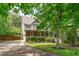 Two-story home with charming curb appeal, featuring manicured landscaping and a welcoming entrance at 297 Curragh Cv, Fuquay Varina, NC 27526
