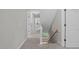 Upstairs hallway with neutral colors, carpet and a window view at 297 Curragh Cv, Fuquay Varina, NC 27526