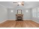 Living room featuring a stone fireplace and hardwood floors at 297 Curragh Cv, Fuquay Varina, NC 27526